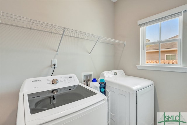 washroom with independent washer and dryer