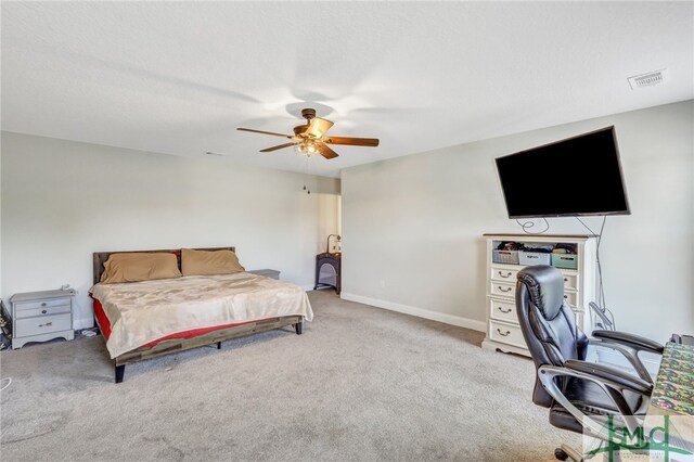 bedroom with light carpet and ceiling fan