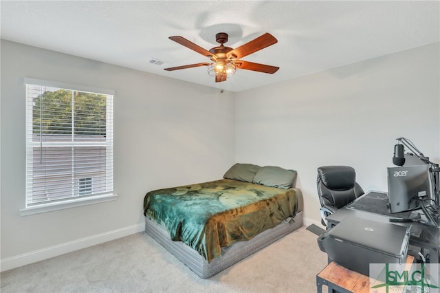 bedroom featuring ceiling fan and light colored carpet