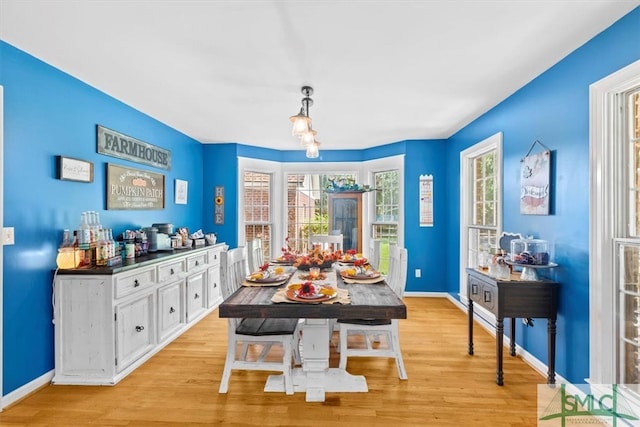 dining space with light hardwood / wood-style floors