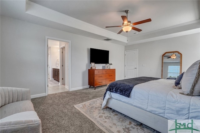 bedroom with light carpet, crown molding, ceiling fan, and a tray ceiling