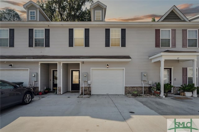 multi unit property featuring a garage