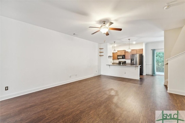 11330 White Bluff Rd Unit 46, Savannah, GA 31419 - unfurnished living room with baseboards, a ceiling fan, and dark wood-style flooring