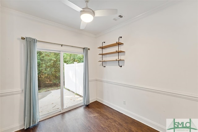 spare room with crown molding, dark hardwood / wood-style flooring, and ceiling fan