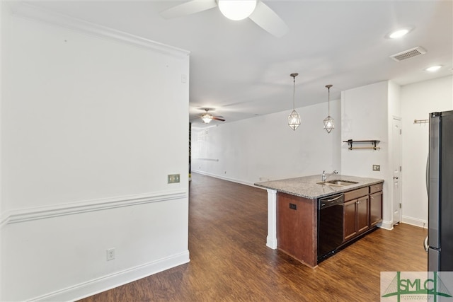 kitchen featuring stainless steel refrigerator, pendant lighting, sink, dishwasher, and dark hardwood / wood-style floors