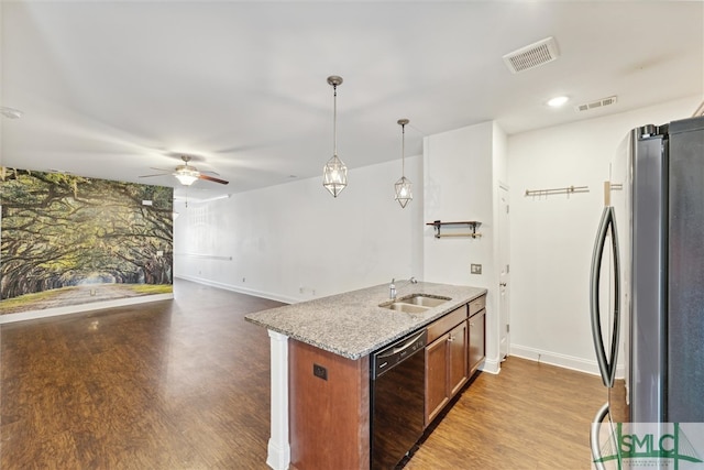 kitchen with stainless steel fridge, sink, decorative light fixtures, dishwasher, and hardwood / wood-style floors