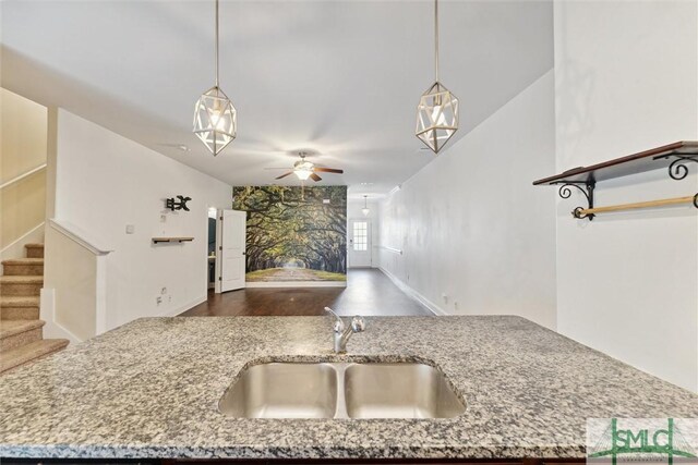 11330 White Bluff Rd Unit 46, Savannah, GA 31419 - kitchen featuring light stone countertops, open floor plan, ceiling fan, a sink, and hanging light fixtures