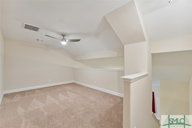 additional living space featuring lofted ceiling, ceiling fan, and light carpet