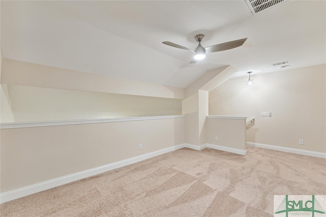 bonus room featuring ceiling fan, vaulted ceiling, and light colored carpet