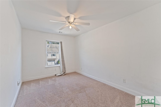 carpeted empty room featuring ceiling fan