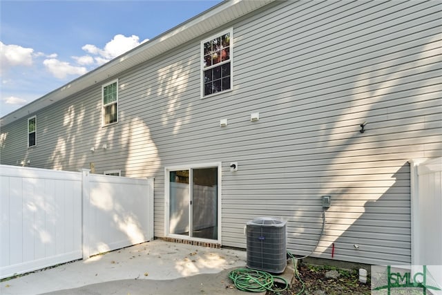 back of house featuring a patio area and central AC