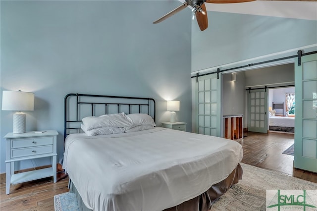 bedroom featuring hardwood / wood-style flooring and ceiling fan