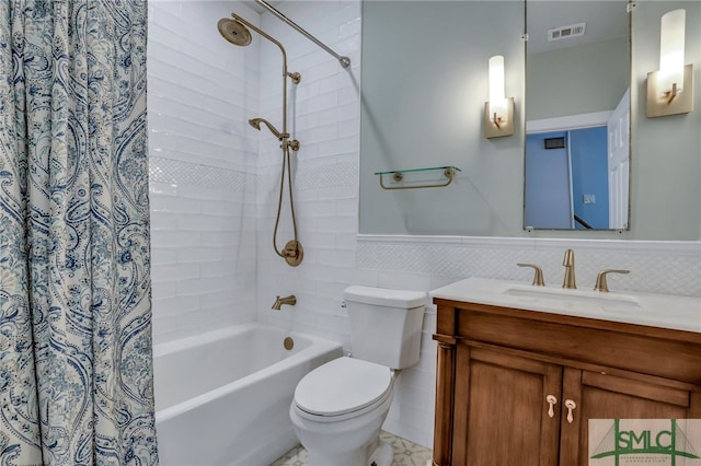 full bathroom featuring shower / bath combination with curtain, vanity, and toilet