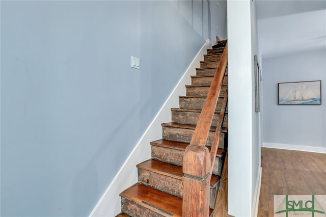 stairway featuring hardwood / wood-style floors