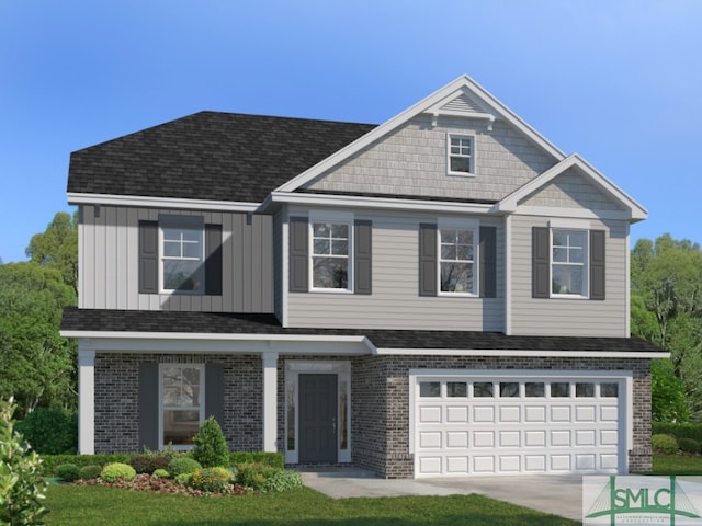 view of front facade featuring a front yard and a garage