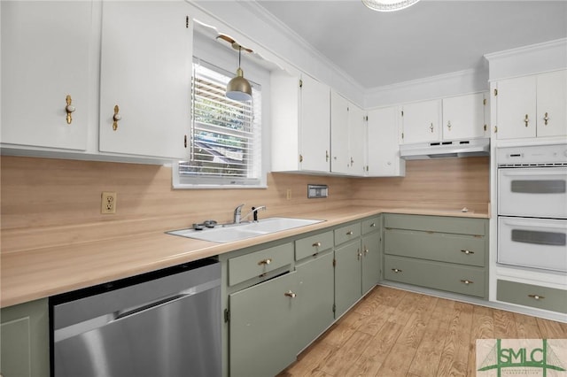 kitchen with sink, hanging light fixtures, light hardwood / wood-style flooring, stainless steel dishwasher, and double oven