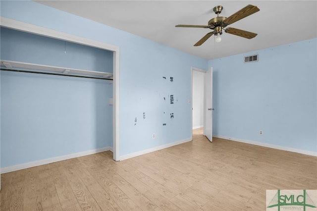 unfurnished bedroom featuring a closet, ceiling fan, and light hardwood / wood-style flooring