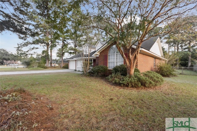 view of home's exterior with a yard and a garage