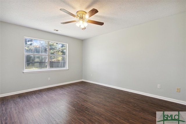 unfurnished room with a textured ceiling, dark hardwood / wood-style floors, and ceiling fan