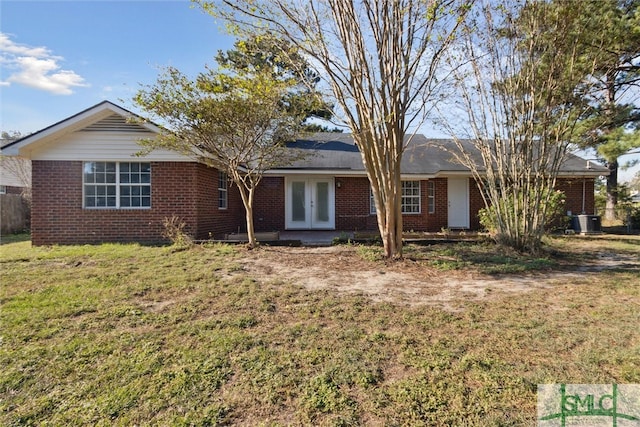 ranch-style house featuring a front yard