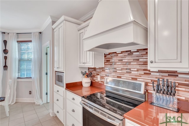 kitchen with white cabinetry, stainless steel appliances, and custom exhaust hood