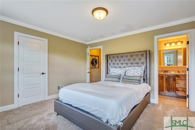 carpeted bedroom with crown molding and ensuite bathroom