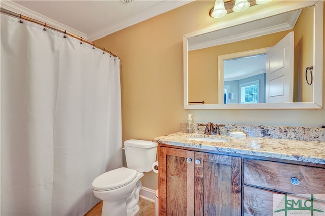 bathroom with vanity, crown molding, and toilet