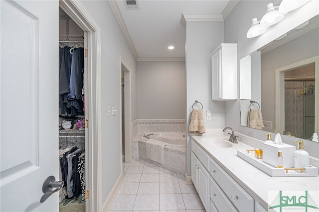 bathroom featuring tile patterned flooring, shower with separate bathtub, vanity, and ornamental molding