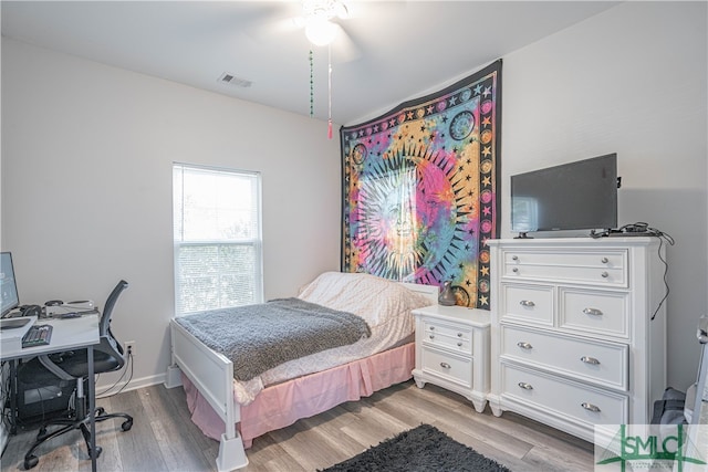 bedroom featuring ceiling fan and light wood-type flooring