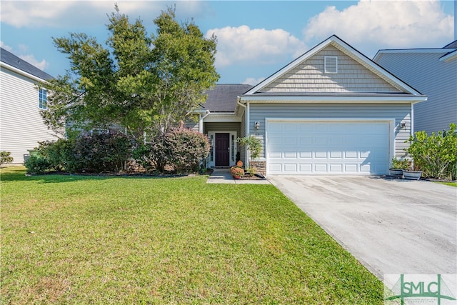 view of front of house featuring a front yard and a garage