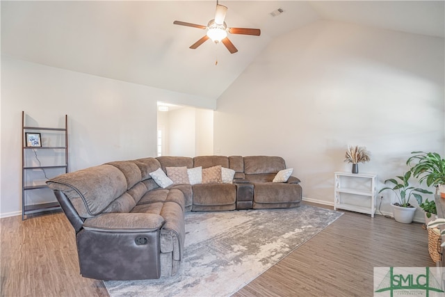 living room featuring ceiling fan, lofted ceiling, and hardwood / wood-style floors