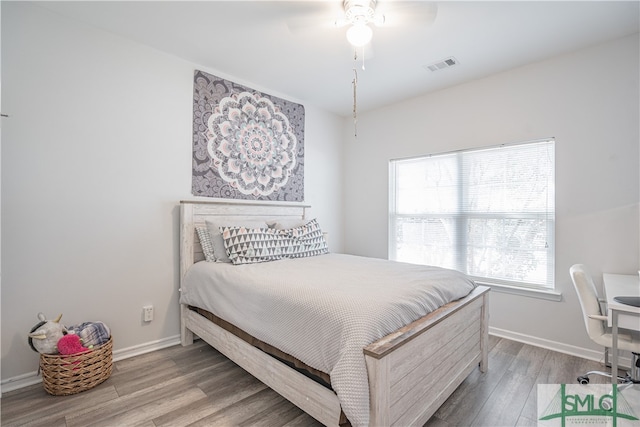 bedroom featuring hardwood / wood-style floors and ceiling fan