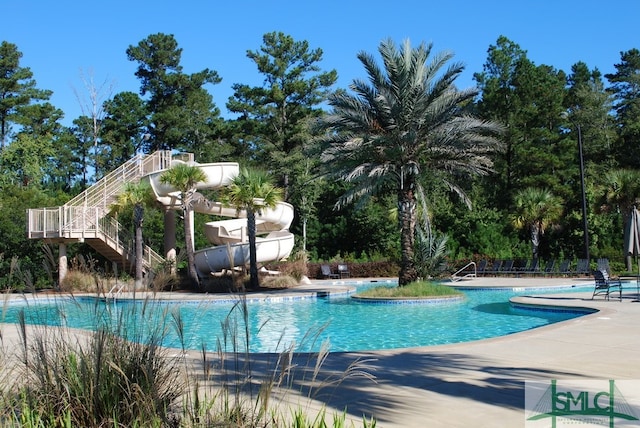 view of swimming pool with a patio