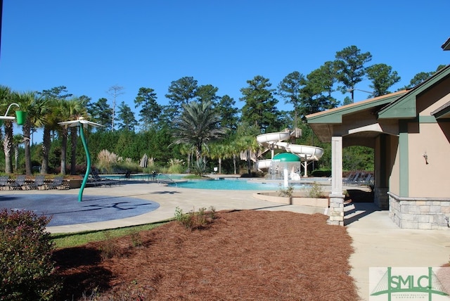 view of pool featuring a patio