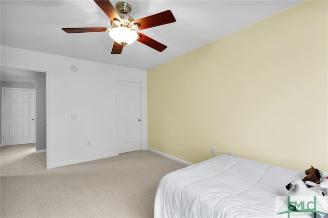 bedroom with ceiling fan and carpet floors