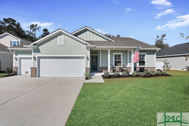 craftsman-style house featuring a front lawn and a garage