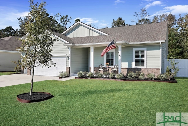 craftsman inspired home with a front yard and a garage