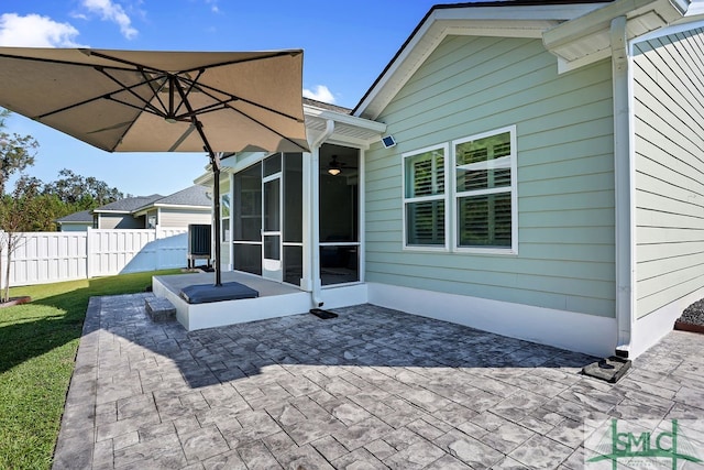 view of patio featuring a sunroom