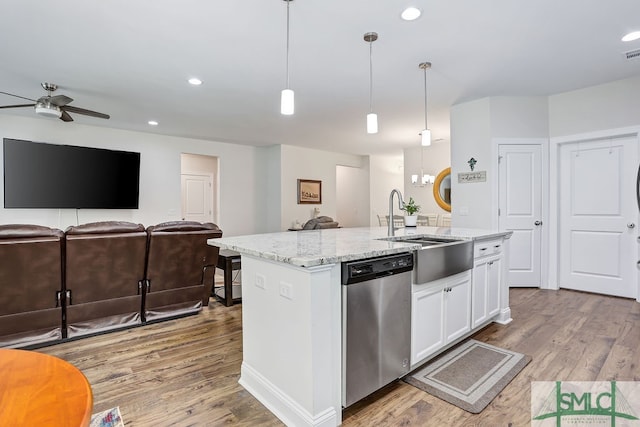 kitchen with white cabinetry, decorative light fixtures, a kitchen island with sink, and stainless steel dishwasher