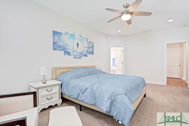 bedroom with connected bathroom, carpet flooring, and ceiling fan