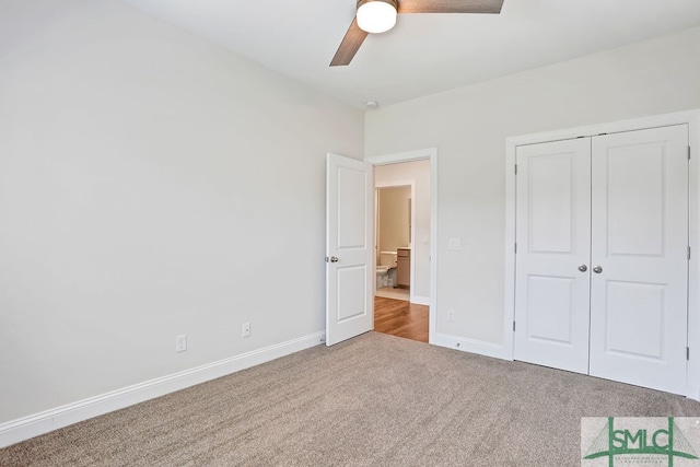 unfurnished bedroom with carpet flooring, a closet, and ceiling fan