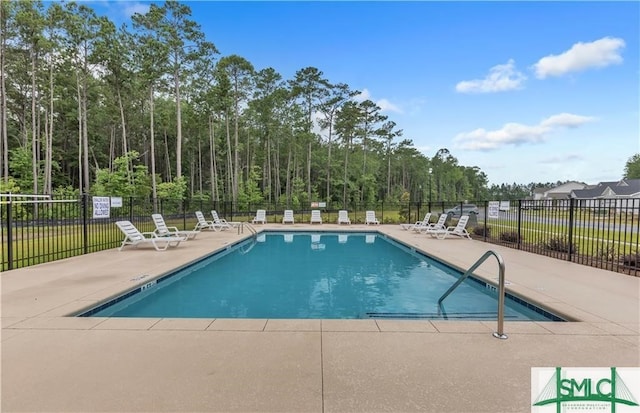 view of swimming pool featuring a patio