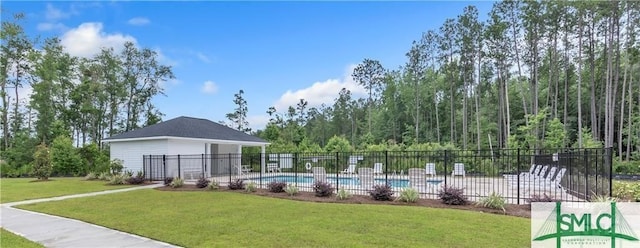 view of pool featuring a yard