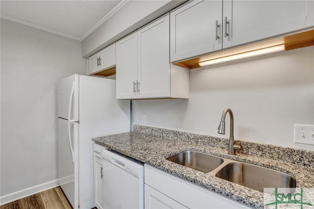 kitchen with dishwasher, wood-type flooring, sink, crown molding, and white cabinetry