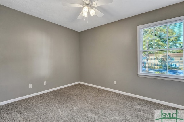 unfurnished room with carpet flooring and ceiling fan