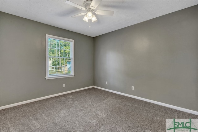 carpeted empty room with a textured ceiling and ceiling fan