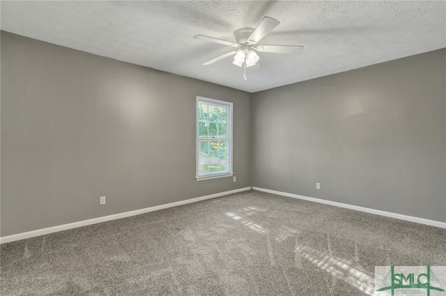 carpeted empty room with a textured ceiling and ceiling fan