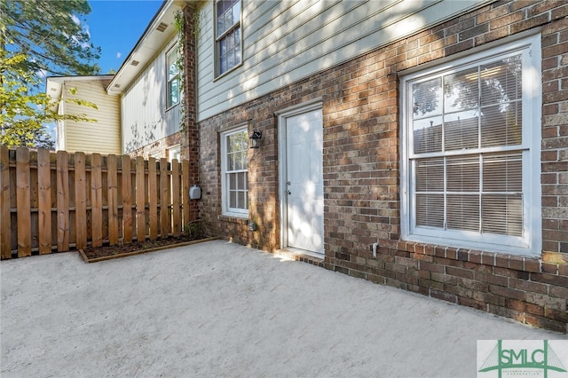 property entrance featuring a patio area