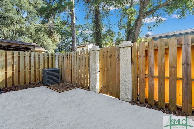 view of yard featuring central AC and a patio area