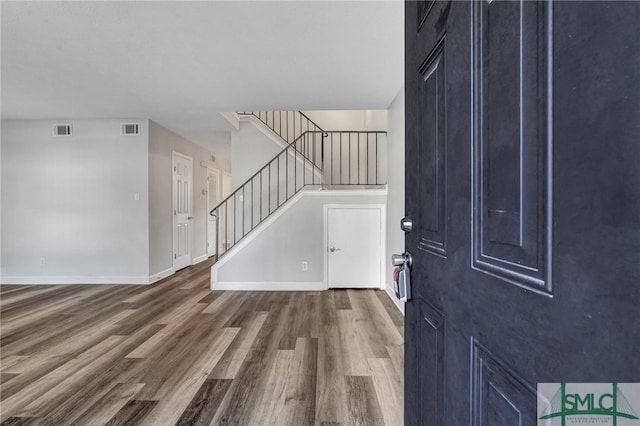 foyer entrance with dark hardwood / wood-style flooring